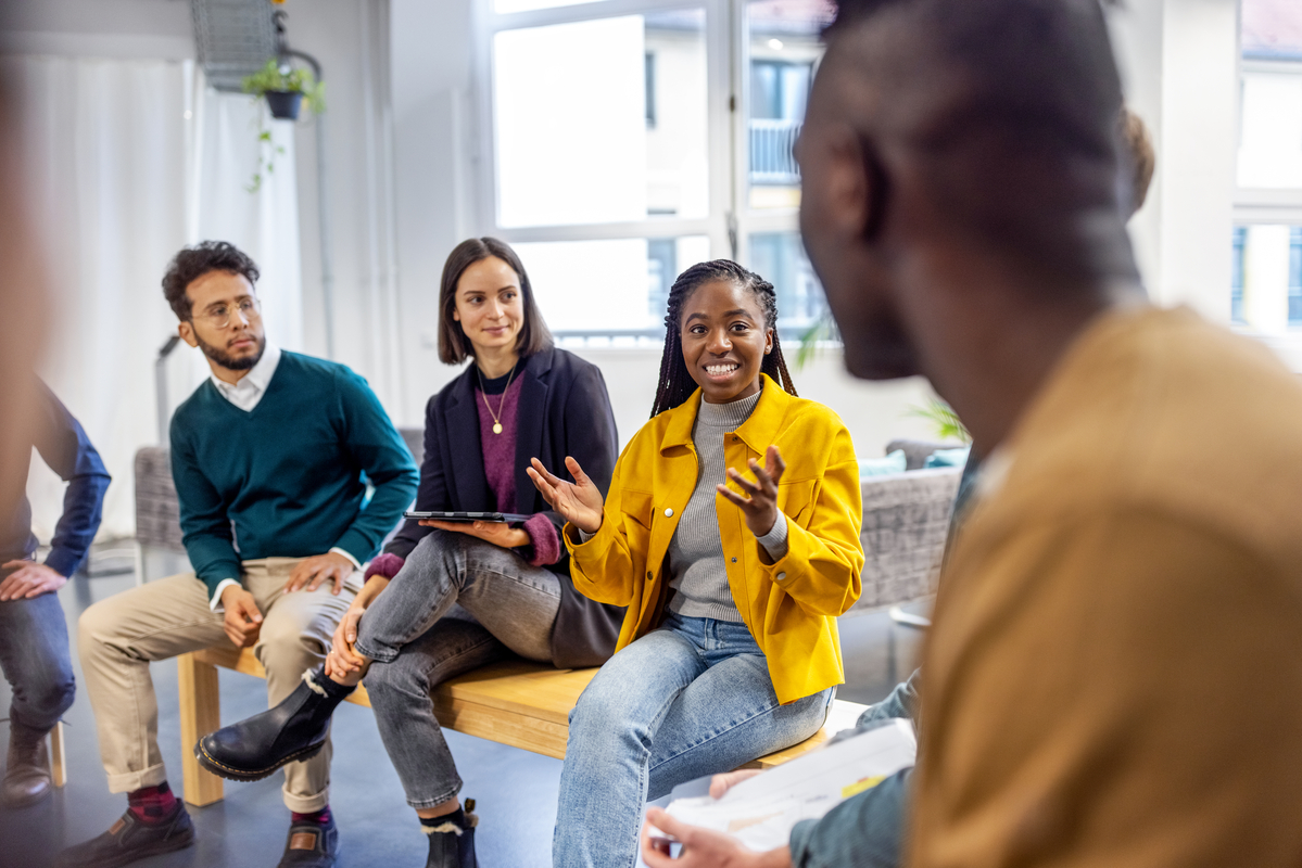 image of a young woman talking to her colleagues